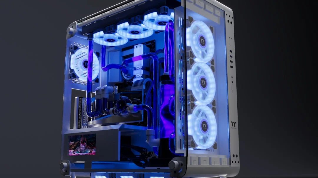 A mid-tower PC build in progress on a workbench, featuring a large dual-tower air cooler mounted on an AM5 motherboard, with braided tubing and a 360mm radiator visible beside it, RGB fans glowing softly in the background